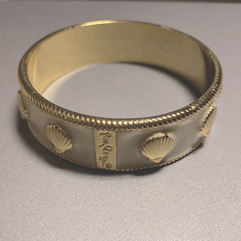 Lilly Pulitzer enamel bangle bracelet with gold seashells.